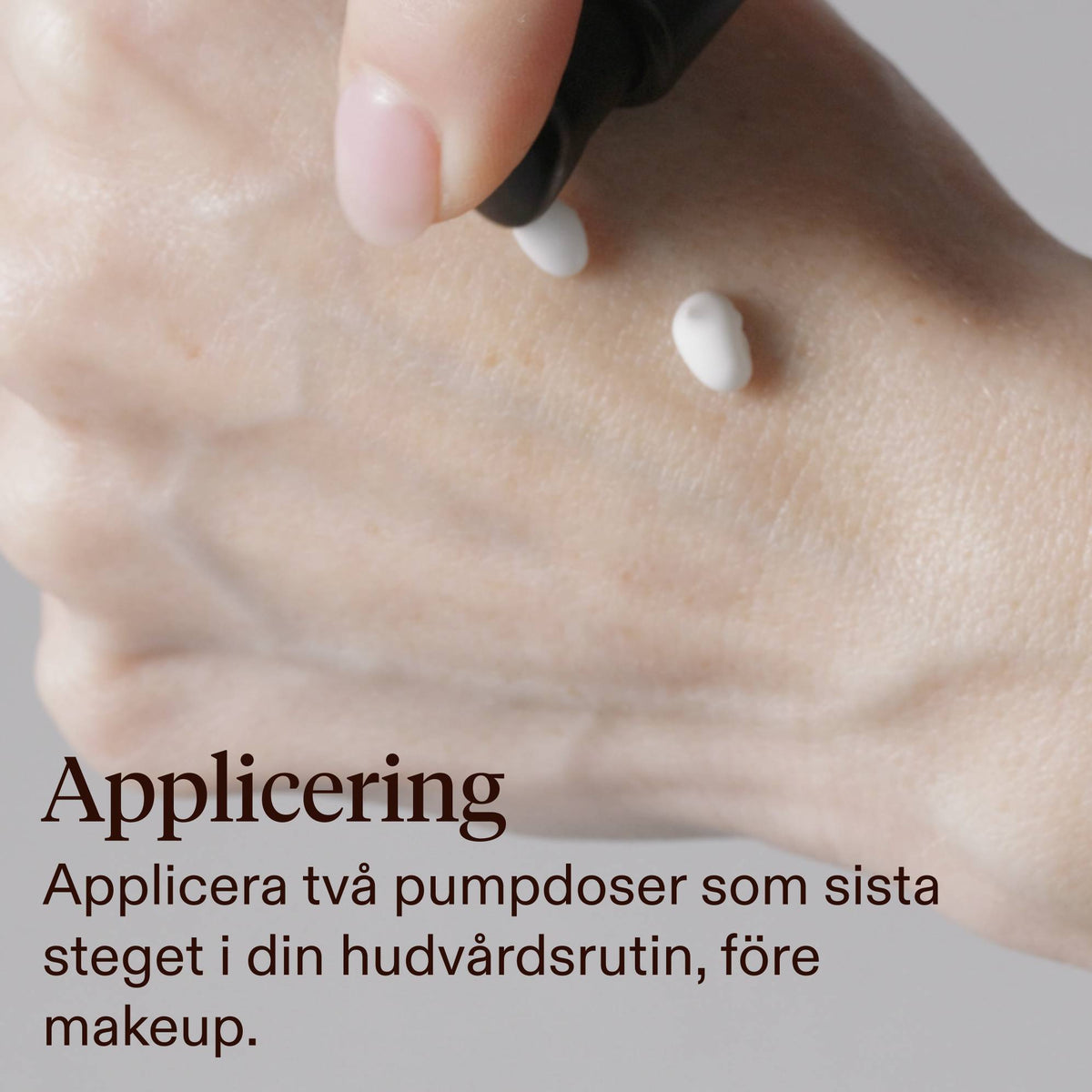 Close-up of a hand with two small white dots of cream being dispensed from a black pump, with text reading 'How to Use: Apply two pumps as the last step in your skincare routine, before makeup.'.