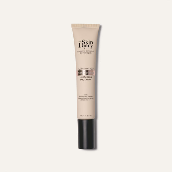 A tube of The Skin Diary Moisturising Day Cream on a clean white background. The tube is beige with a black cap, and the brand name 'The Skin Diary' is printed in black on the front.